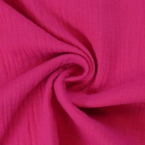 Heller rosa Bio XXL-Tuch aus Musselin, vielseitig als Schal oder Tuch tragbar, weich und atmungsaktiv.