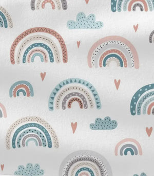 Wickelauflagen Set in Pastell-Regenbogenfarben, individuell konfigurierbar, mit bunten Stoffmustern für Babys.