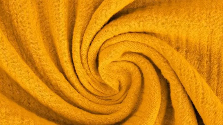 Bio XXL-Musselintuch in Ocker-Senf, weiches Schal aus Bio-Baumwolle, vielseitig tragbar, natürliche Textur, langlebig.